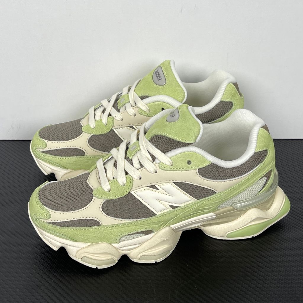Side profile of the Women's New Balance 9060 sneaker featuring a breathable Dry Lime mesh upper, premium Thunder Brown suede overlays, a classic 'N' logo, and a dramatic, chunky wavy midsole with ABZORB cushioning.