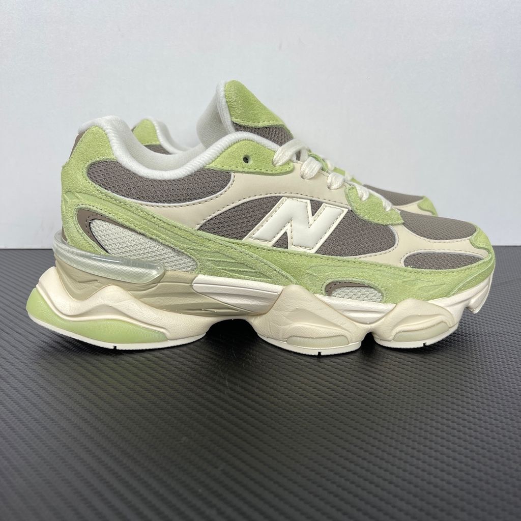 Side profile of the Women's New Balance 9060 sneaker featuring a breathable Dry Lime mesh upper, premium Thunder Brown suede overlays, a classic 'N' logo, and a dramatic, chunky wavy midsole with ABZORB cushioning.