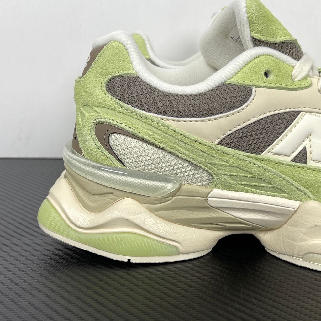 Side profile of the Women's New Balance 9060 sneaker featuring a breathable Dry Lime mesh upper, premium Thunder Brown suede overlays, a classic 'N' logo, and a dramatic, chunky wavy midsole with ABZORB cushioning.