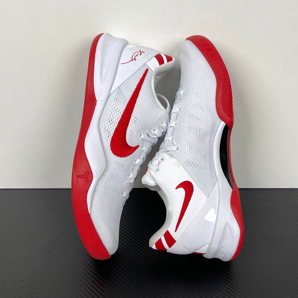 Side profile of the Nike Kobe 8 Protro TB Promo basketball shoe featuring a clean white Engineered Mesh upper, vibrant University Red accents on the embroidered Swoosh and laces, and a white rubber outsole with a carbon fiber shank plate.