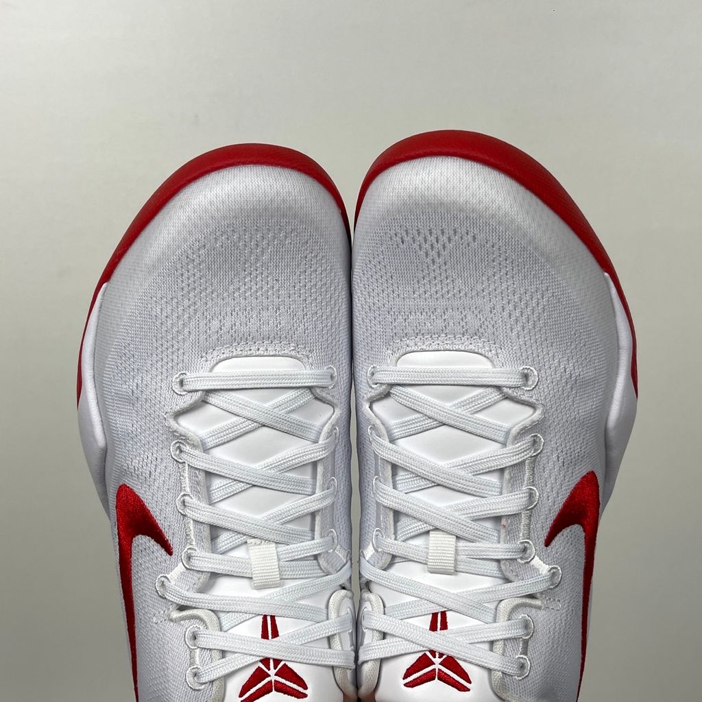 Side profile of the Nike Kobe 8 Protro TB Promo basketball shoe featuring a clean white Engineered Mesh upper, vibrant University Red accents on the embroidered Swoosh and laces, and a white rubber outsole with a carbon fiber shank plate.