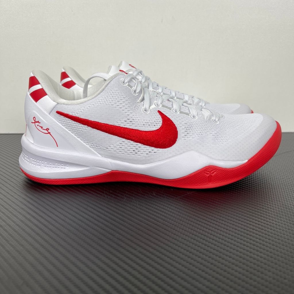 Side profile of the Nike Kobe 8 Protro TB Promo basketball shoe featuring a clean white Engineered Mesh upper, vibrant University Red accents on the embroidered Swoosh and laces, and a white rubber outsole with a carbon fiber shank plate.