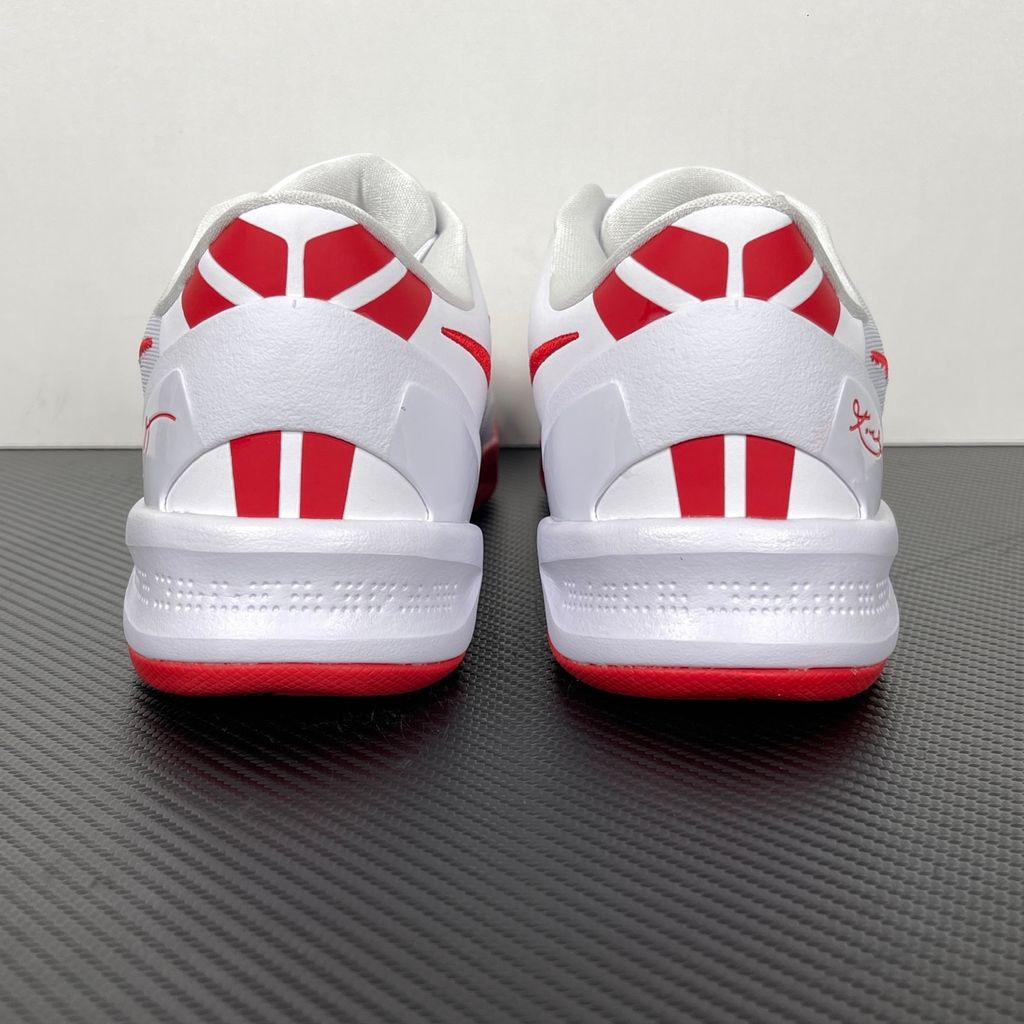 Side profile of the Nike Kobe 8 Protro TB Promo basketball shoe featuring a clean white Engineered Mesh upper, vibrant University Red accents on the embroidered Swoosh and laces, and a white rubber outsole with a carbon fiber shank plate.