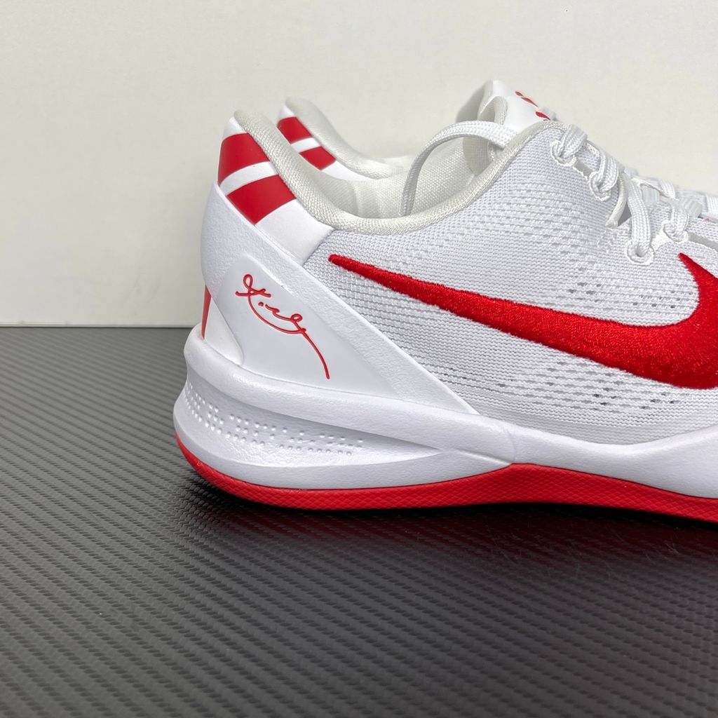 Side profile of the Nike Kobe 8 Protro TB Promo basketball shoe featuring a clean white Engineered Mesh upper, vibrant University Red accents on the embroidered Swoosh and laces, and a white rubber outsole with a carbon fiber shank plate.