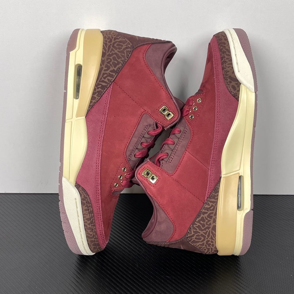 Side profile of the Air Jordan 3 Retro PRM 'Bin 23' sneaker featuring rich, premium tumbled leather, classic elephant print overlays on the toe and heel, the exclusive red Bin 23 wax seal stamp, and a classic midsole with a visible Air unit.