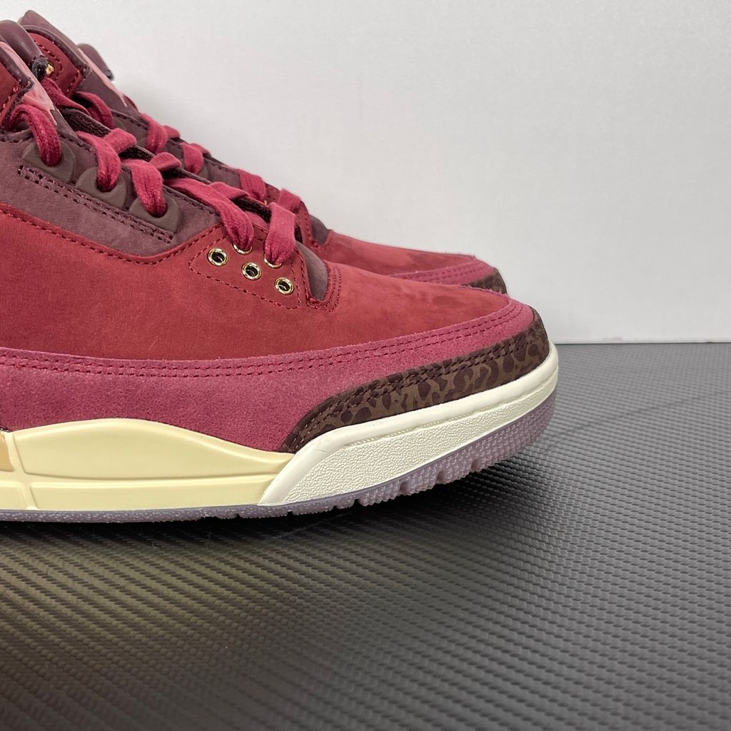 Side profile of the Air Jordan 3 Retro PRM 'Bin 23' sneaker featuring rich, premium tumbled leather, classic elephant print overlays on the toe and heel, the exclusive red Bin 23 wax seal stamp, and a classic midsole with a visible Air unit.