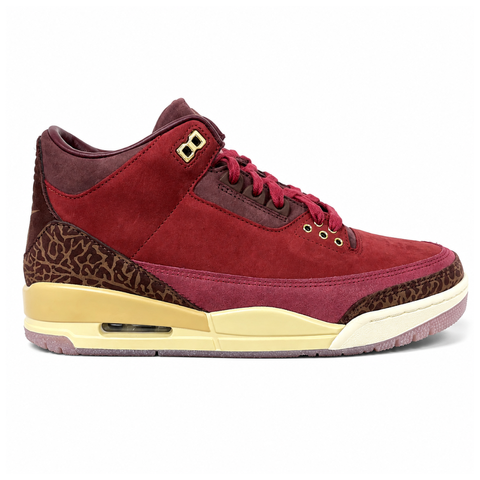 Side profile of the Air Jordan 3 Retro PRM 'Bin 23' sneaker featuring rich, premium tumbled leather, classic elephant print overlays on the toe and heel, the exclusive red Bin 23 wax seal stamp, and a classic midsole with a visible Air unit.
