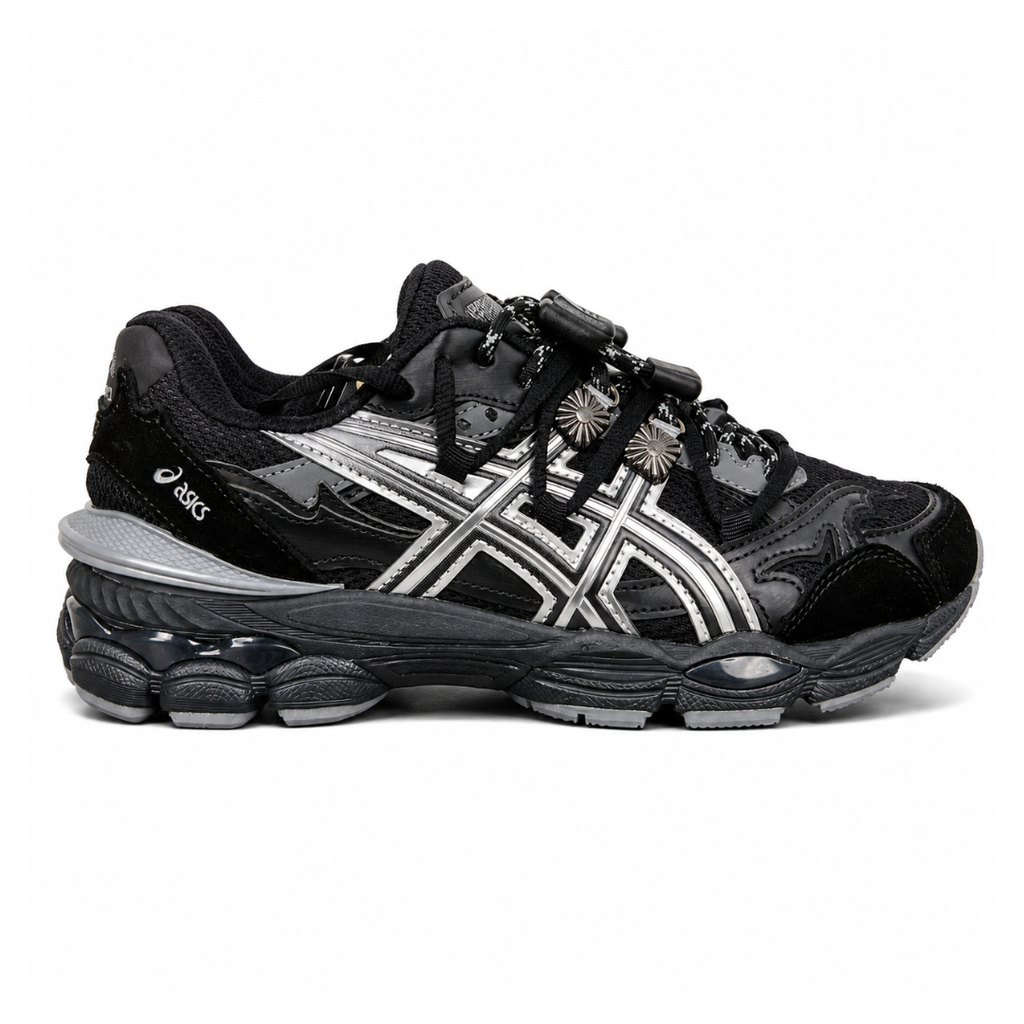 Side profile of the collaborative ASICS x TOGA Gel-Cumulus 16 sneaker in a Grey, Black, and Pure Silver colorway, featuring a breathable mesh upper, striking metallic silver overlays, sleek black accents, and a sculpted GEL-cushioned midsole.