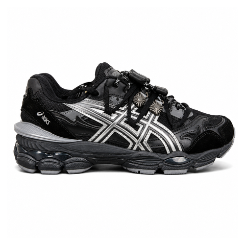 Side profile of the collaborative ASICS x TOGA Gel-Cumulus 16 sneaker in a Grey, Black, and Pure Silver colorway, featuring a breathable mesh upper, striking metallic silver overlays, sleek black accents, and a sculpted GEL-cushioned midsole.