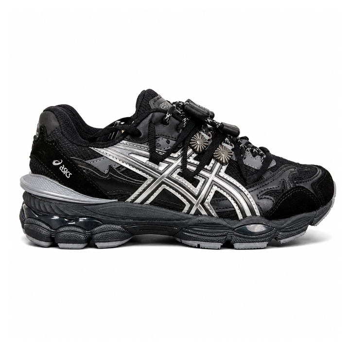 Side profile of the collaborative ASICS x TOGA Gel-Cumulus 16 sneaker in a Grey, Black, and Pure Silver colorway, featuring a breathable mesh upper, striking metallic silver overlays, sleek black accents, and a sculpted GEL-cushioned midsole.