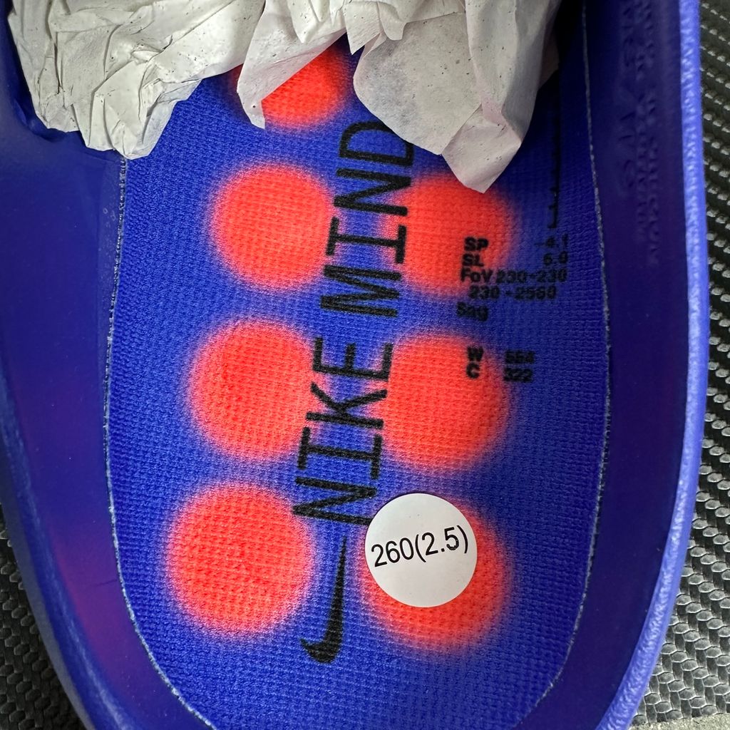 Side profile of the Nike Mind 001 AMP Slide 'Spider-Man' featuring a molded foam construction, iconic red and blue superhero color blocking, subtle web-inspired graphic textures on the strap, and a contoured footbed for all-day comfort.