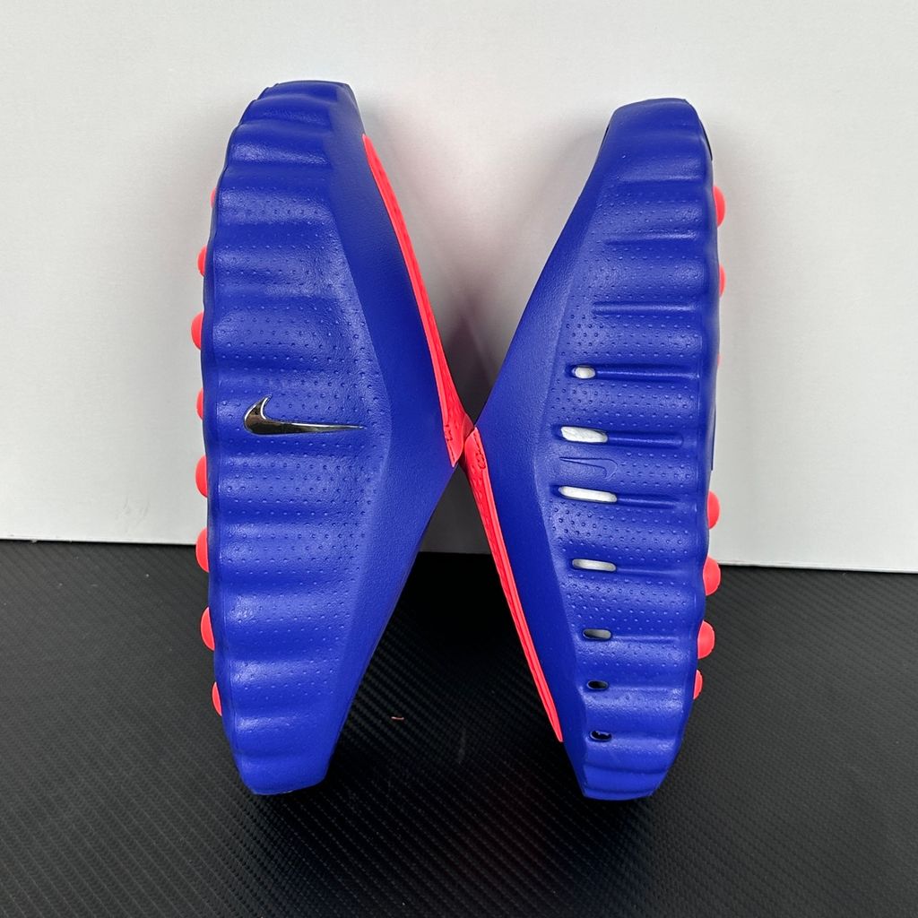Side profile of the Nike Mind 001 AMP Slide 'Spider-Man' featuring a molded foam construction, iconic red and blue superhero color blocking, subtle web-inspired graphic textures on the strap, and a contoured footbed for all-day comfort.