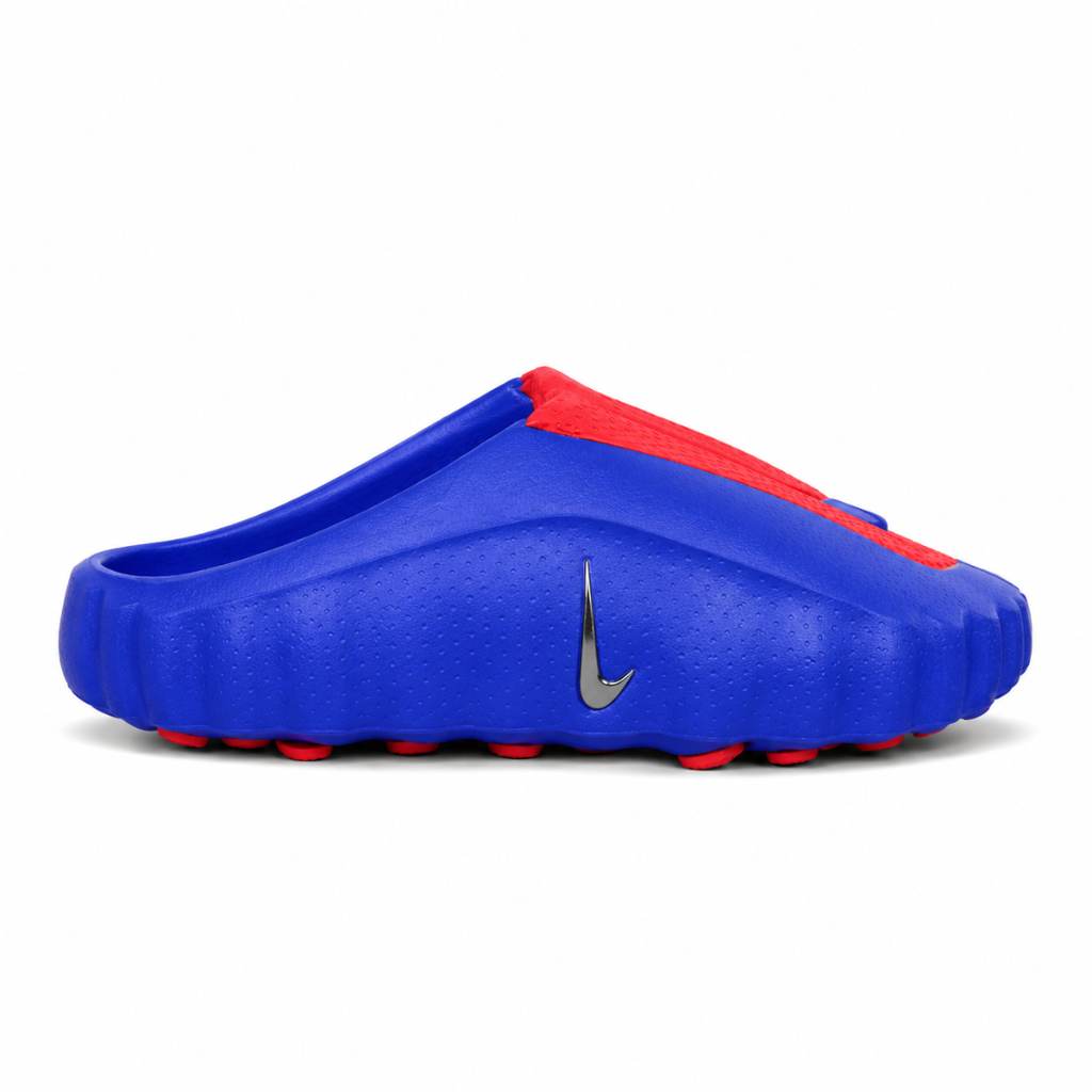 Side profile of the Nike Mind 001 AMP Slide 'Spider-Man' featuring a molded foam construction, iconic red and blue superhero color blocking, subtle web-inspired graphic textures on the strap, and a contoured footbed for all-day comfort.