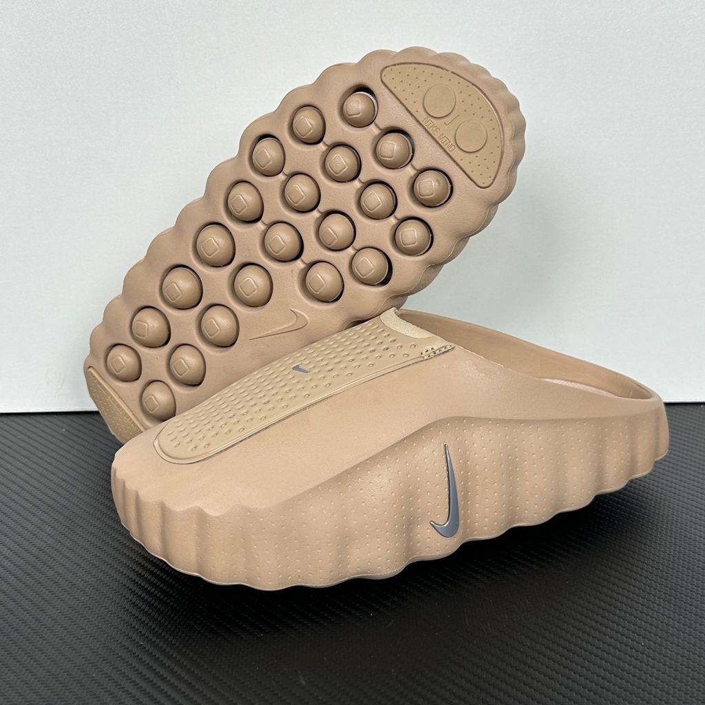 Side profile of the Nike Mind 001 AMP Slide 'Spider-Man' featuring a molded foam construction, iconic red and blue superhero color blocking, subtle web-inspired graphic textures on the strap, and a contoured footbed for all-day comfort.