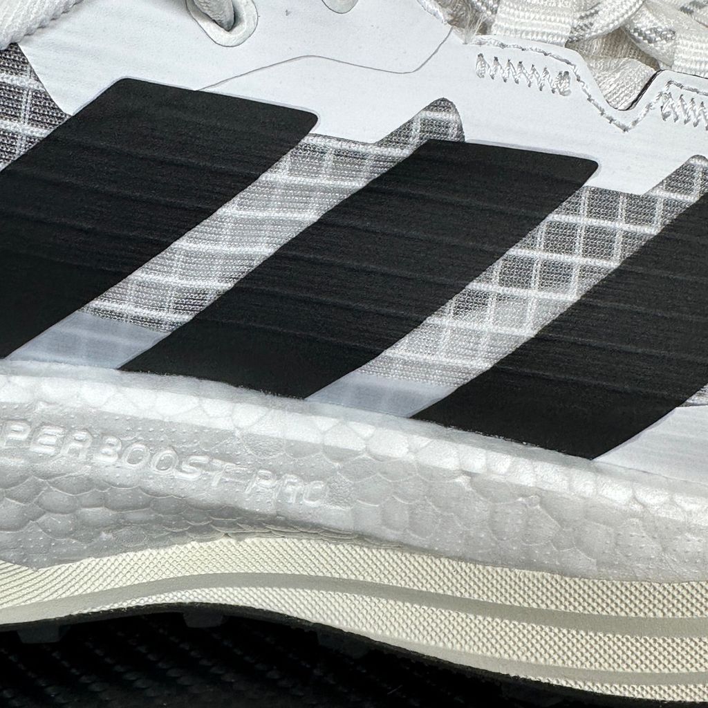 Side profile of the adidas Terrex Freehiker 3 Low GORE-TEX sneaker featuring a breathable white mesh upper equipped with a waterproof membrane, durable black synthetic overlays, and a rugged Continental Rubber outsole with aggressive traction lugs.