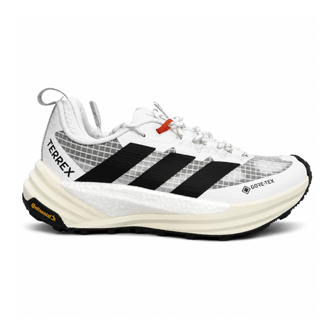 Side profile of the adidas Terrex Freehiker 3 Low GORE-TEX sneaker featuring a breathable white mesh upper equipped with a waterproof membrane, durable black synthetic overlays, and a rugged Continental Rubber outsole with aggressive traction lugs.