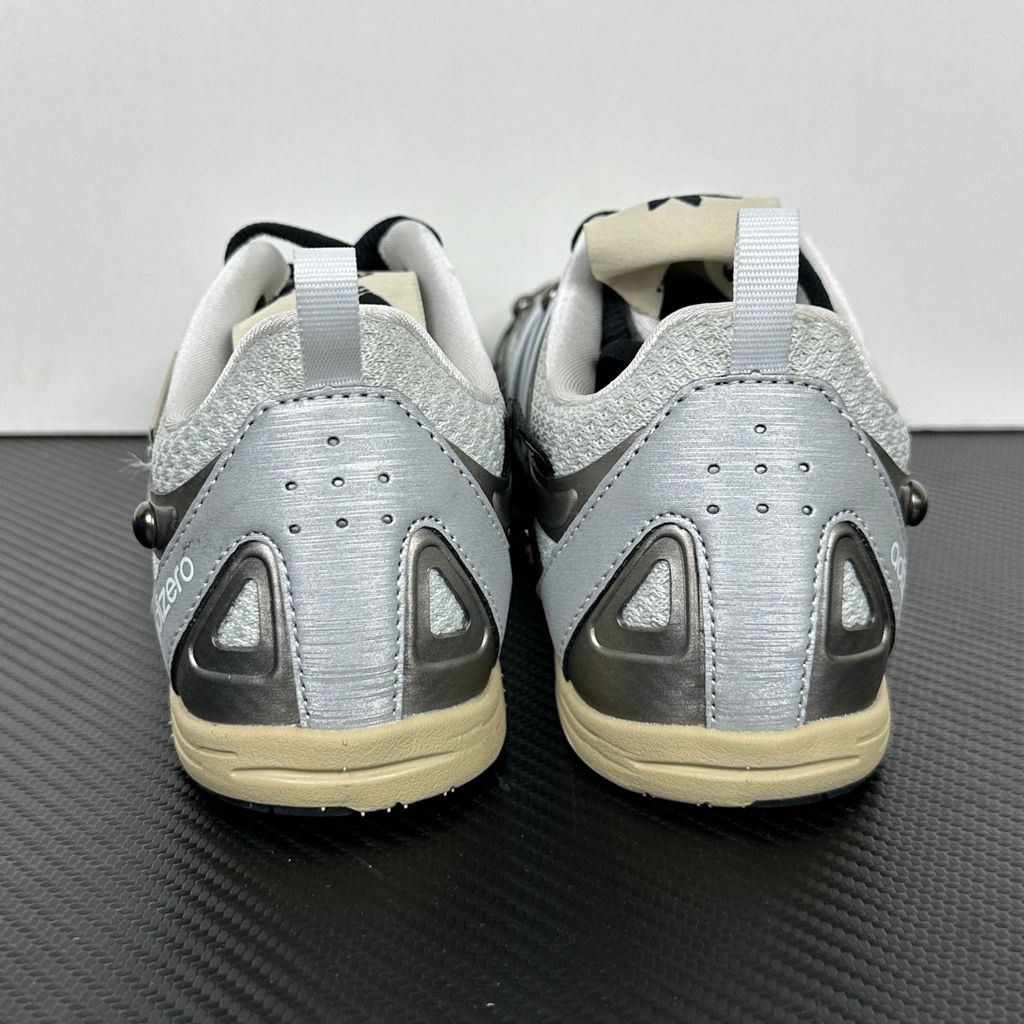 Side profile of the adidas Adizero PR x Song for the Mute collaborative sneaker featuring a crisp white breathable mesh base, gleaming silver metallic synthetic overlays, signature raw-edge and frayed textile accents, and a lightweight cushioned midsole.