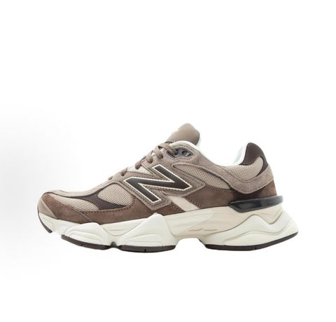 Side profile of the New Balance 9060 sneaker featuring a breathable thunder grey mesh base, rich brown premium suede and nubuck overlays, stonewear accents, the classic 'N' logo, and an exaggerated, sculpted chunky midsole.
