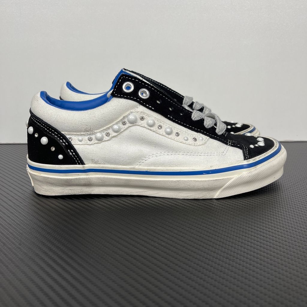 Side profile of Vans OTW Old Skool Reissue 36 Pearlized Marshmallow VN000S52FS8 with cream canvas, black suede panels, pearl and crystal studs and a blue foxing stripe.