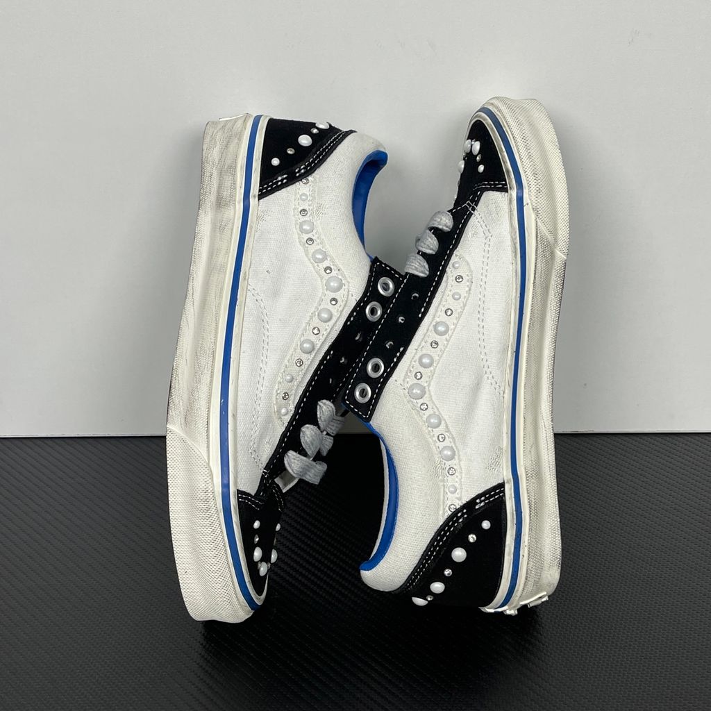 Side profile of Vans OTW Old Skool Reissue 36 Pearlized Marshmallow VN000S52FS8 with cream canvas, black suede panels, pearl and crystal studs and a blue foxing stripe.