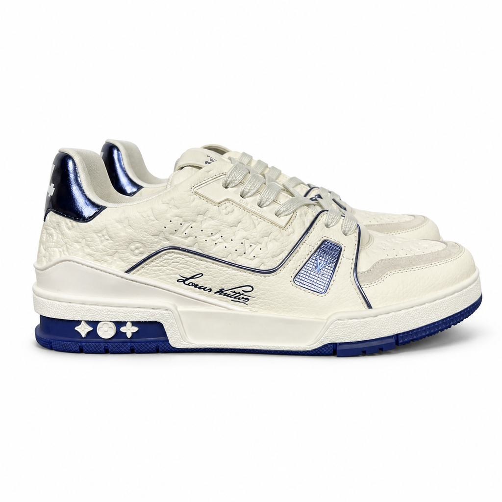 Side profile of Louis Vuitton LV Trainer Sneaker in Marine navy 1AKCPO with Monogram-debossed calf leather and contrasting trim.