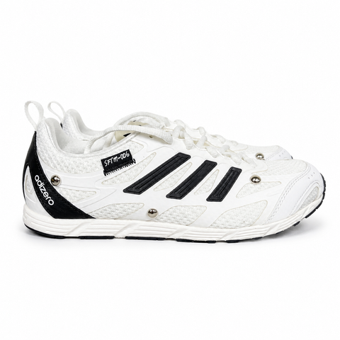 Alt text: Side profile of adidas Adizero PR x Song for the Mute HP3524 in white and black with mesh panels, Three Stripes and silver-tone studs.