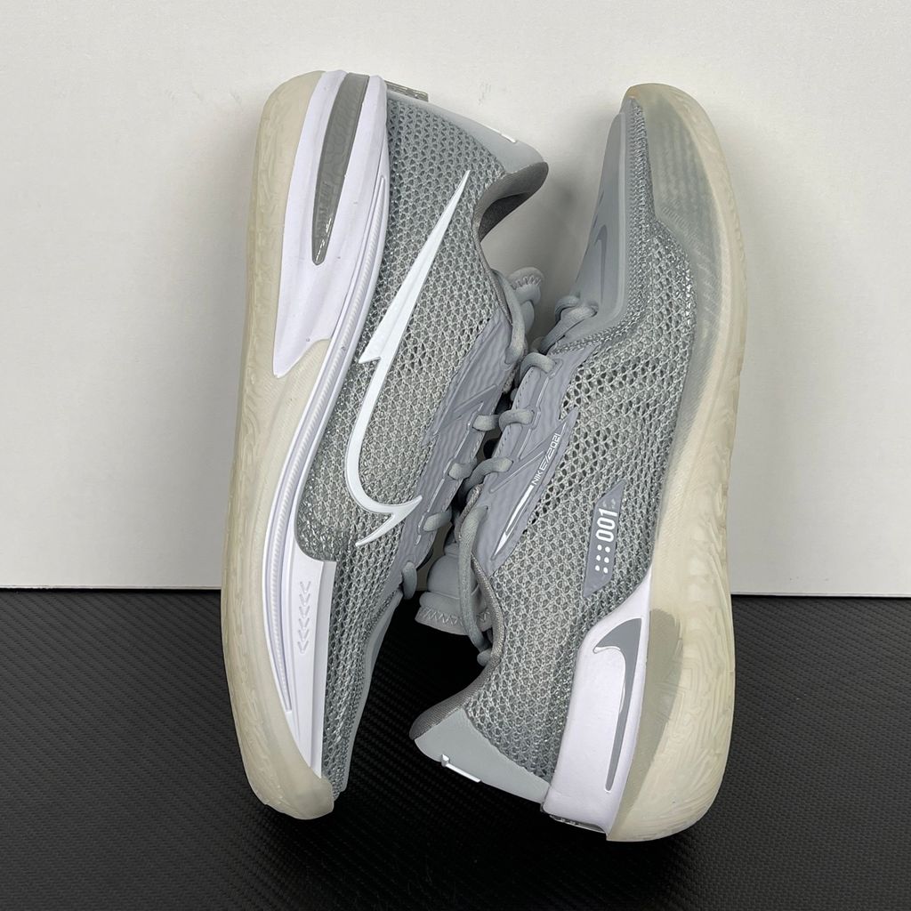 Side profile of Nike Air Zoom G.T. Cut 1 TB Wolf Grey DM5039-003 performance basketball shoe with grey mesh and black Swoosh branding.
