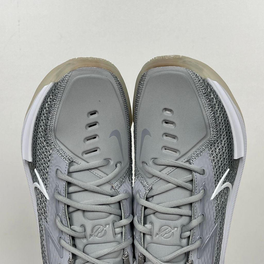 Side profile of Nike Air Zoom G.T. Cut 1 TB Wolf Grey DM5039-003 performance basketball shoe with grey mesh and black Swoosh branding.