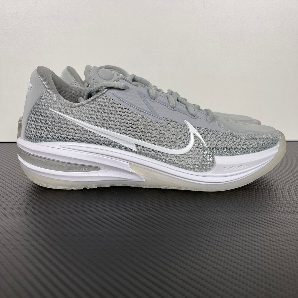 Side profile of Nike Air Zoom G.T. Cut 1 TB Wolf Grey DM5039-003 performance basketball shoe with grey mesh and black Swoosh branding.