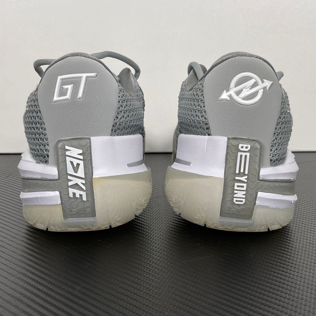 Side profile of Nike Air Zoom G.T. Cut 1 TB Wolf Grey DM5039-003 performance basketball shoe with grey mesh and black Swoosh branding.