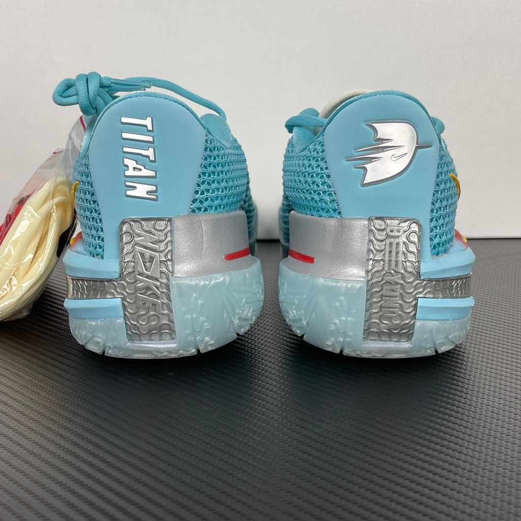 Side profile of Dylan Harper x TITAN x Nike Air Zoom GT Cut Bleached Aqua IU0779-400 with sunrise-gradient Swoosh.