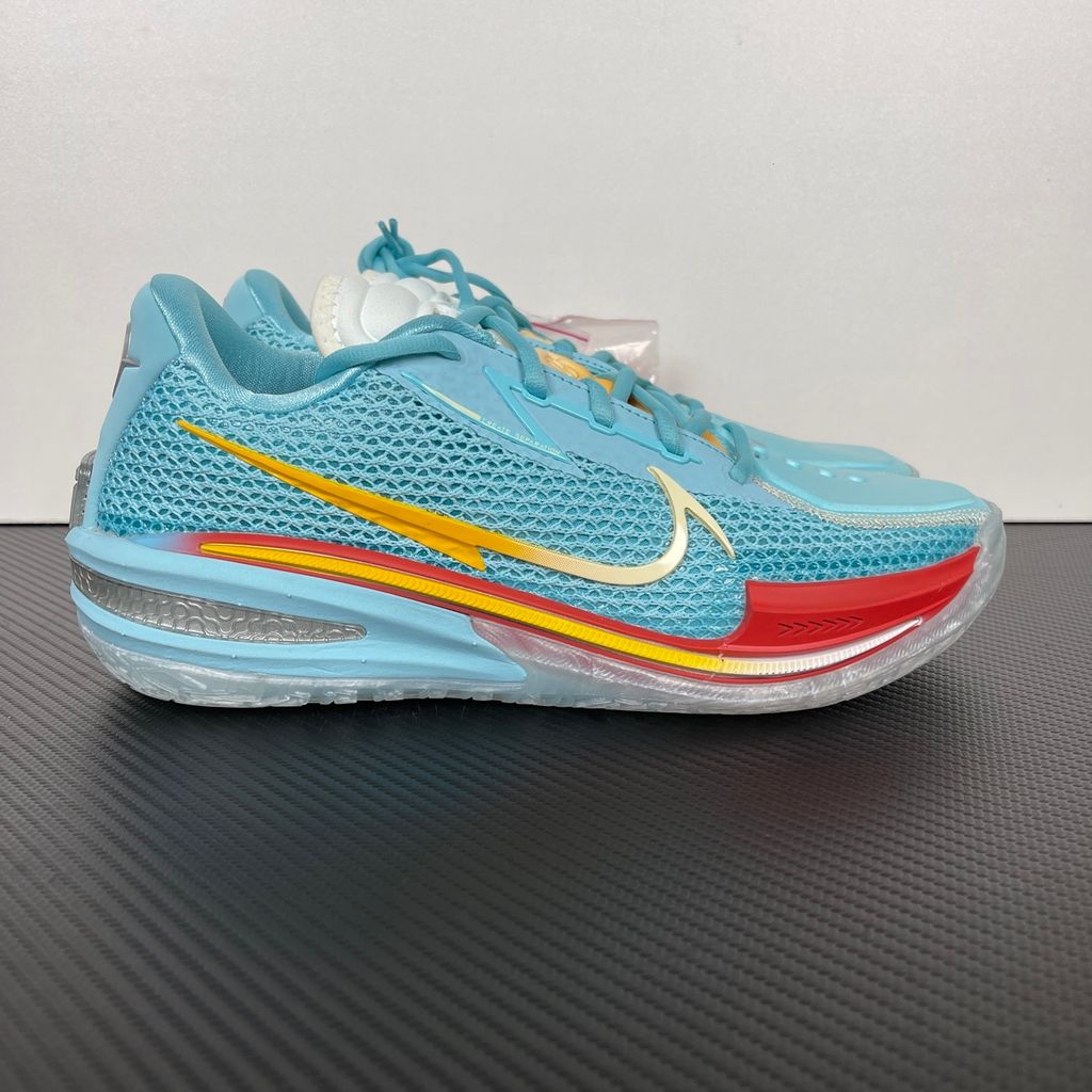 Side profile of Dylan Harper x TITAN x Nike Air Zoom GT Cut Bleached Aqua IU0779-400 with sunrise-gradient Swoosh.