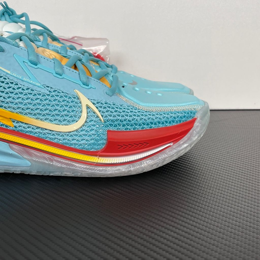 Side profile of Dylan Harper x TITAN x Nike Air Zoom GT Cut Bleached Aqua IU0779-400 with sunrise-gradient Swoosh.