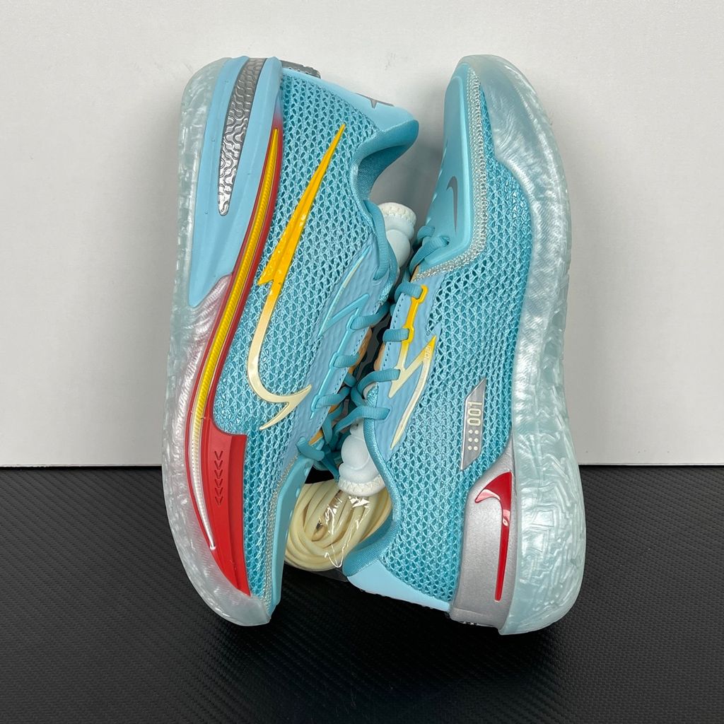 Side profile of Dylan Harper x TITAN x Nike Air Zoom GT Cut Bleached Aqua IU0779-400 with sunrise-gradient Swoosh.