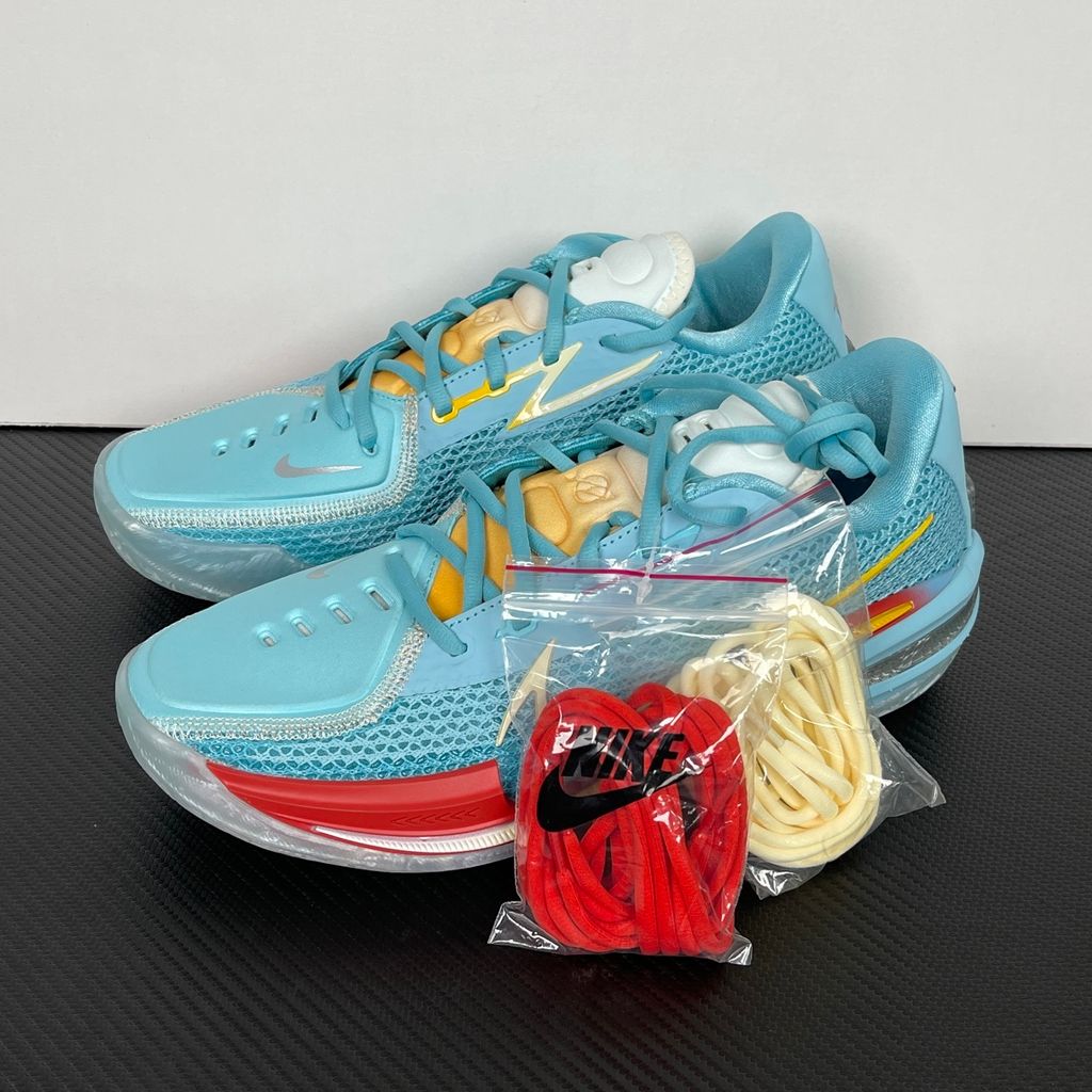 Side profile of Dylan Harper x TITAN x Nike Air Zoom GT Cut Bleached Aqua IU0779-400 with sunrise-gradient Swoosh.