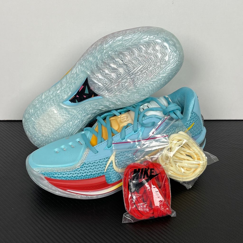Side profile of Dylan Harper x TITAN x Nike Air Zoom GT Cut Bleached Aqua IU0779-400 with sunrise-gradient Swoosh.