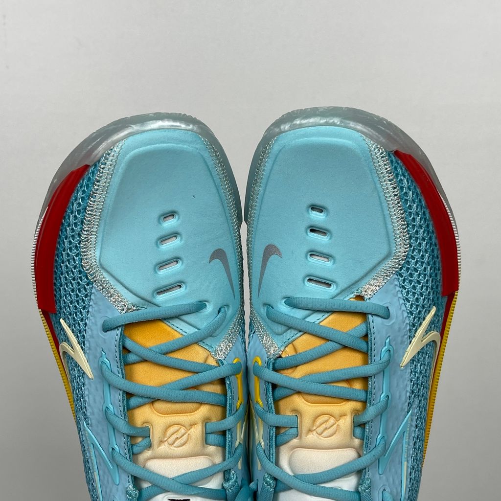 Side profile of Dylan Harper x TITAN x Nike Air Zoom GT Cut Bleached Aqua IU0779-400 with sunrise-gradient Swoosh.