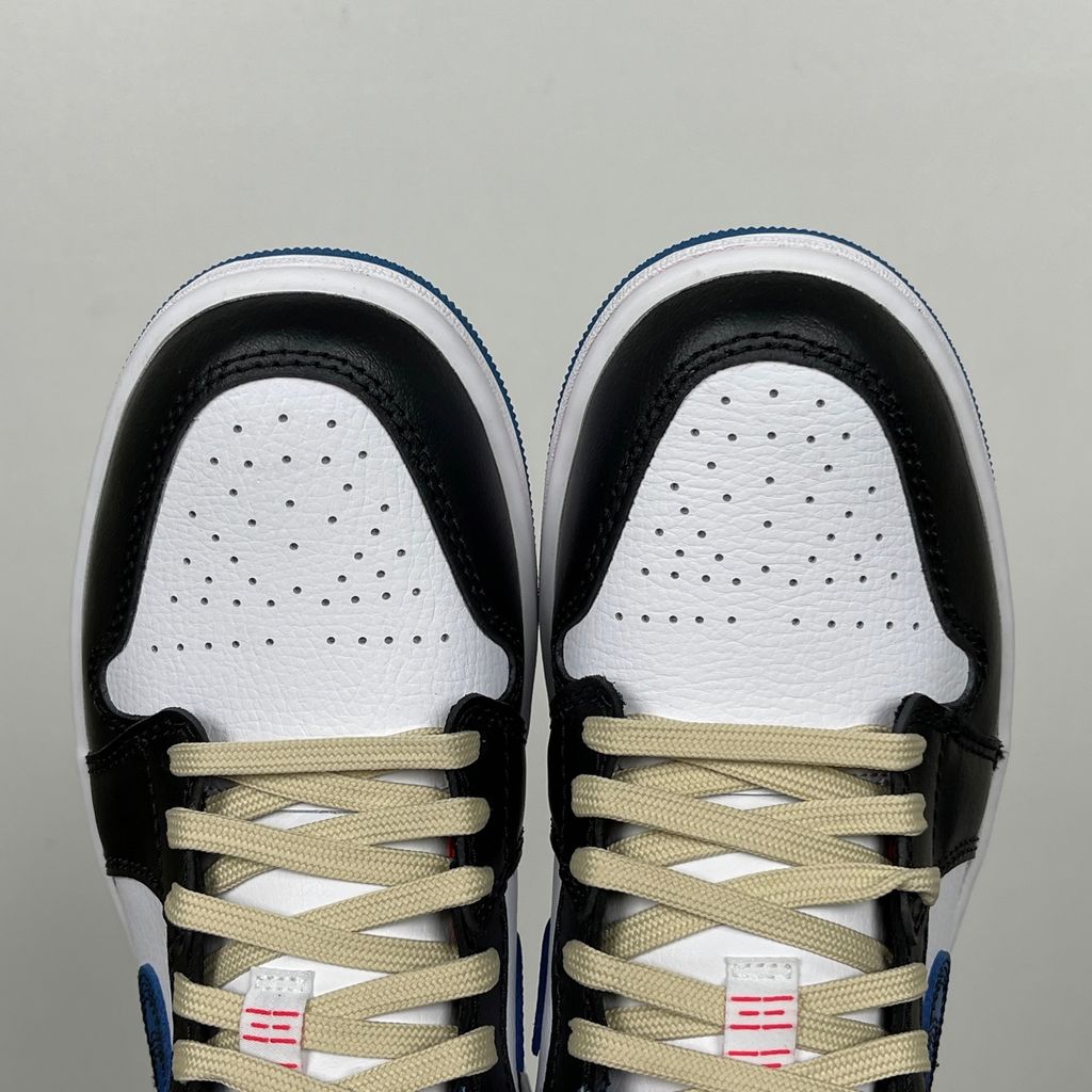 Side profile of Air Jordan 1 Low SE Industrial Blue Sashiko FV3622-141 with white leather, blue details and decorative stitching.  Image