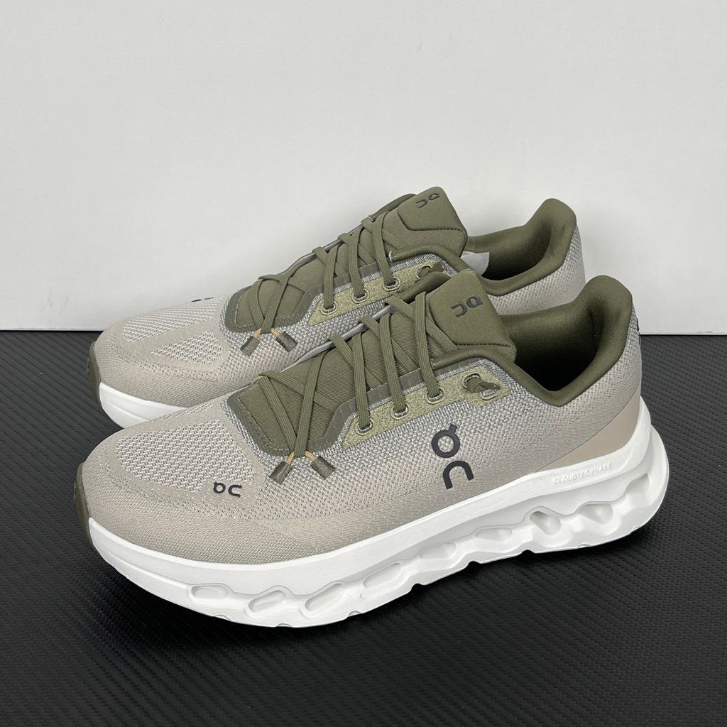 Side profile of men’s On Cloudtilt Olive Desert 3ME10104843 with recycled mesh and CloudTec Phase cushioning.