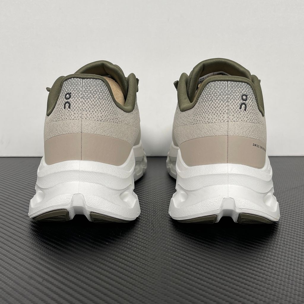 Side profile of men’s On Cloudtilt Olive Desert 3ME10104843 with recycled mesh and CloudTec Phase cushioning.