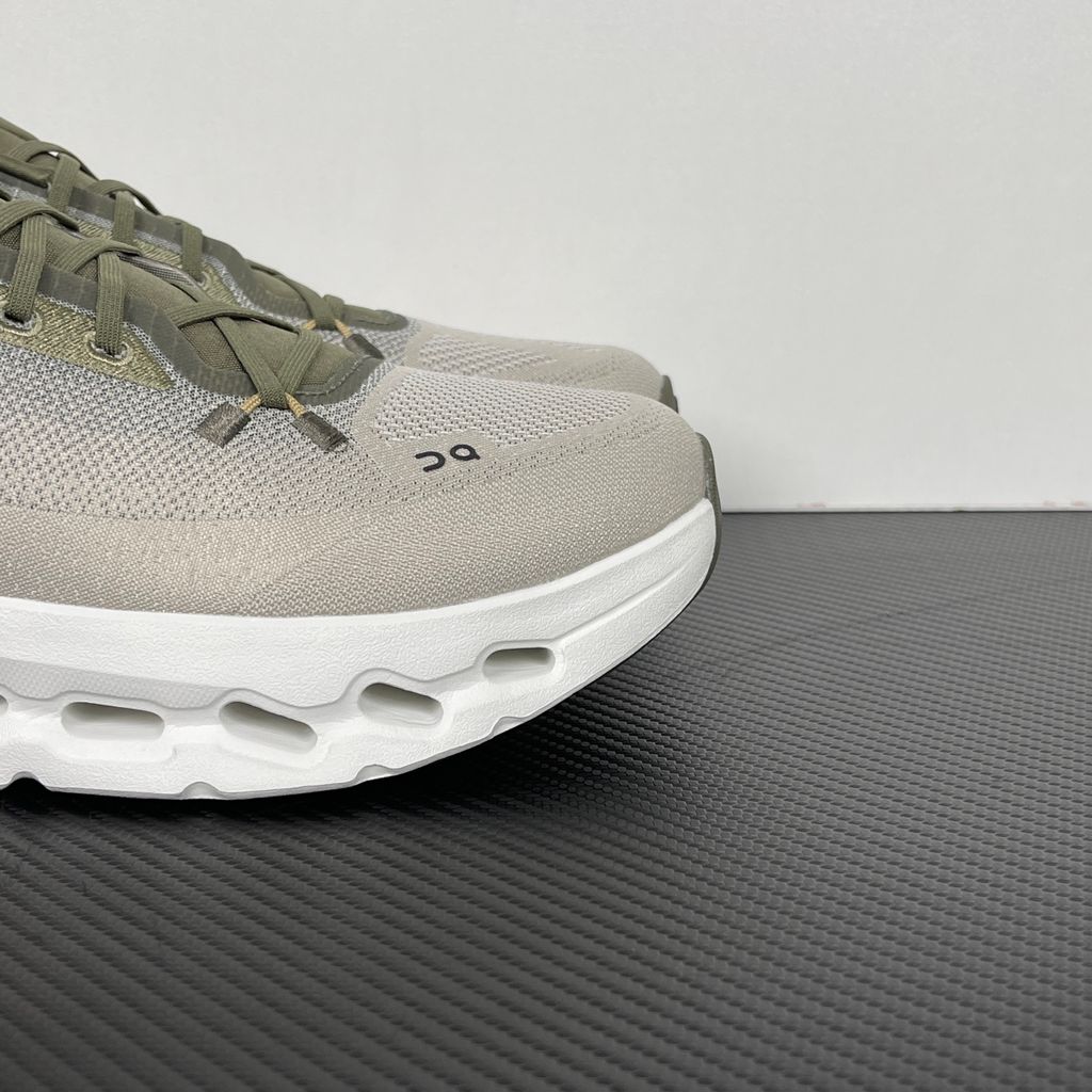 Side profile of men’s On Cloudtilt Olive Desert 3ME10104843 with recycled mesh and CloudTec Phase cushioning.