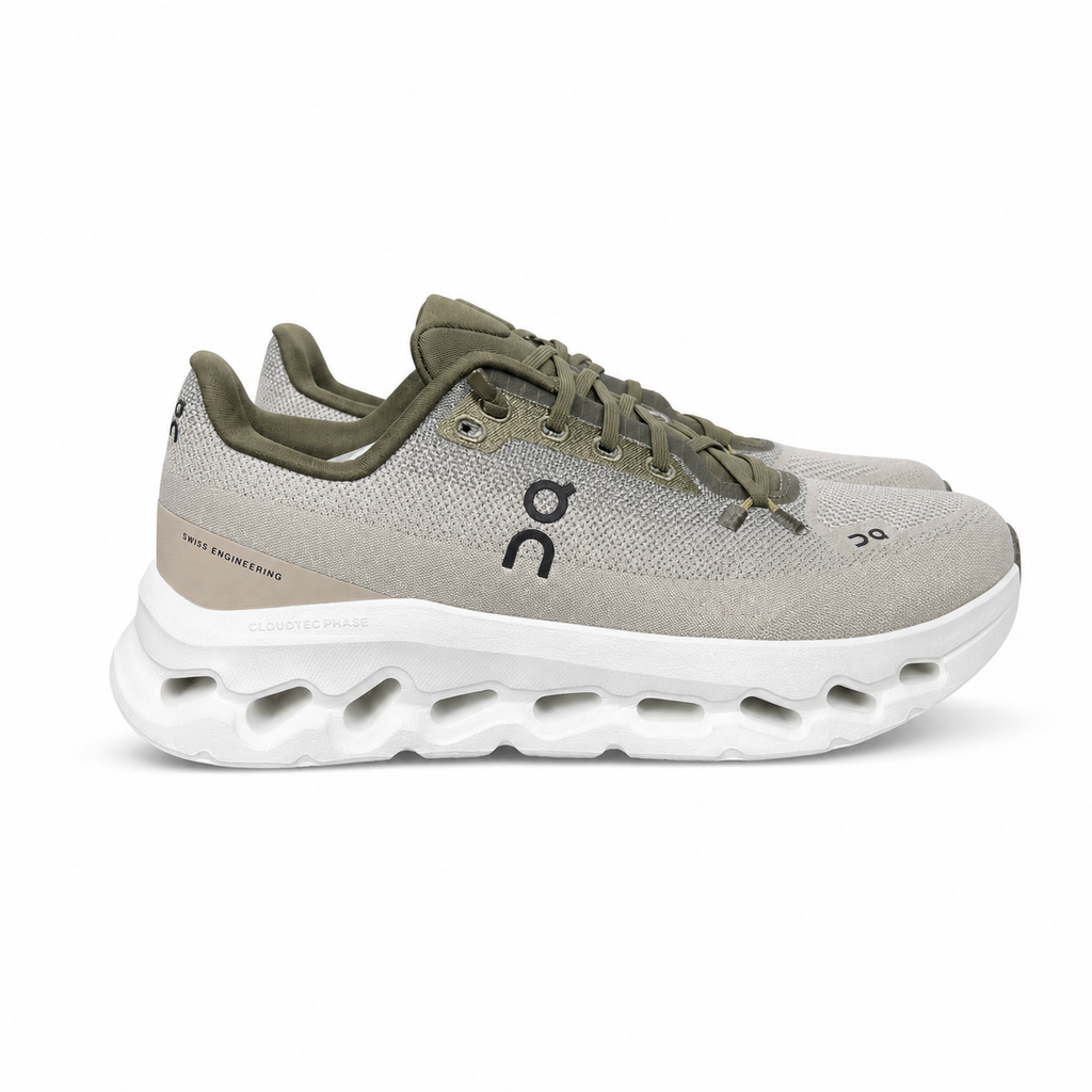 Side profile of men’s On Cloudtilt Olive Desert 3ME10104843 with recycled mesh and CloudTec Phase cushioning.