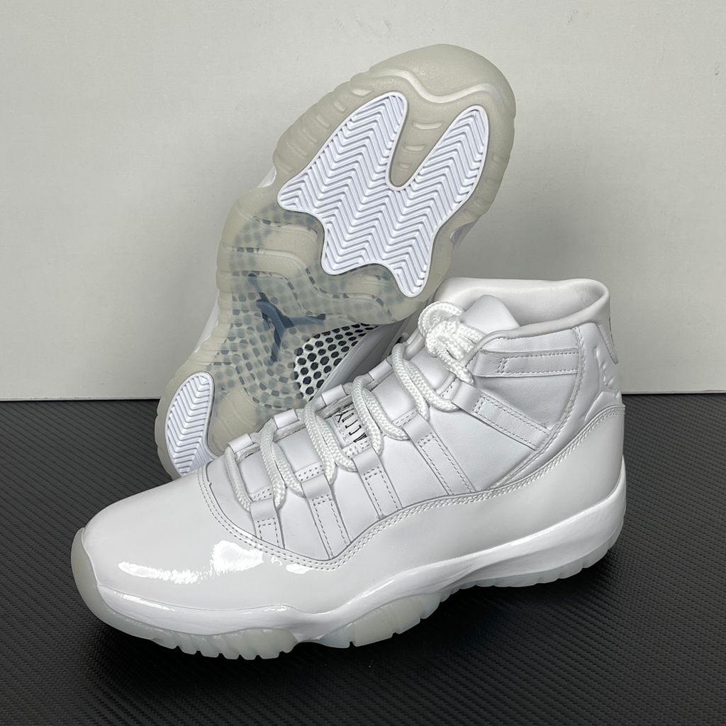 Jordan 11 Retro Comme des Garçons Homme Plus White IV7639-100 sneaker with a premium leather upper, tonal patent mudguard and CDG branding, side view.