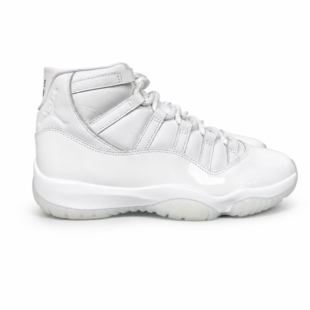 Jordan 11 Retro Comme des Garçons Homme Plus White IV7639-100 sneaker with a premium leather upper, tonal patent mudguard and CDG branding, side view.