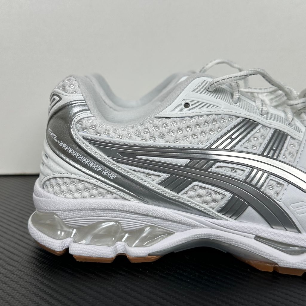 ASICS Gel-Kayano 14 A.P.C. White Pure Silver 1203A727-100 unisex sneaker with white mesh, metallic silver overlays and GEL cushioning, side view.