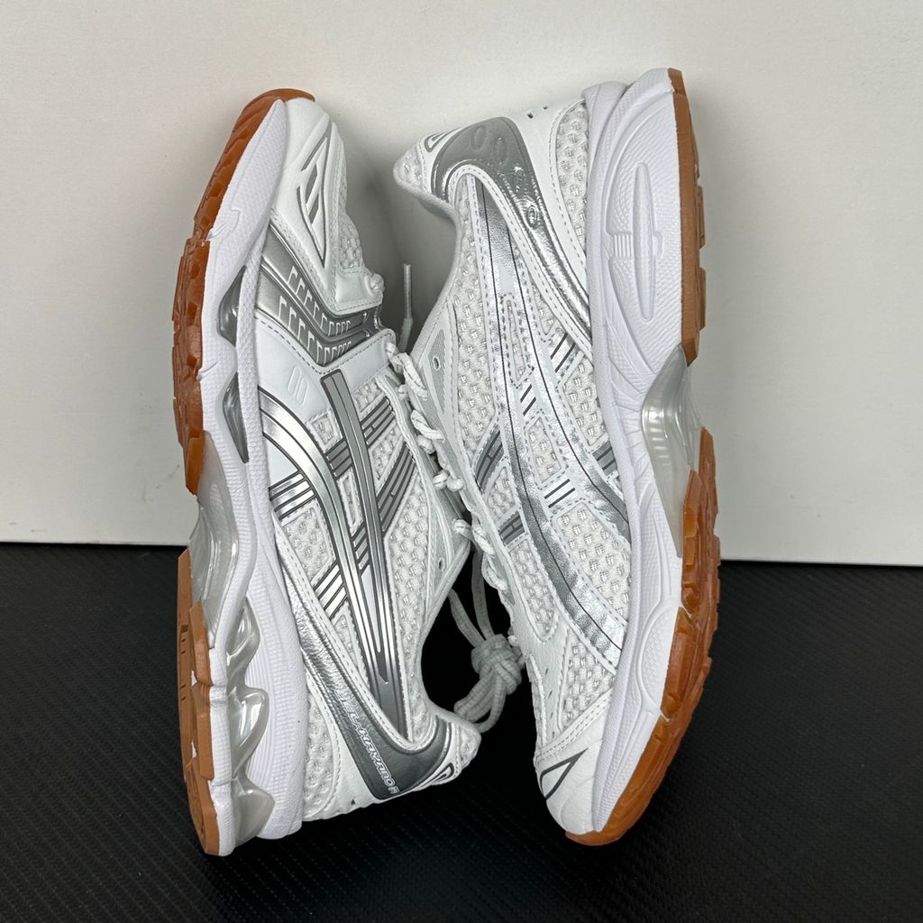 ASICS Gel-Kayano 14 A.P.C. White Pure Silver 1203A727-100 unisex sneaker with white mesh, metallic silver overlays and GEL cushioning, side view.
