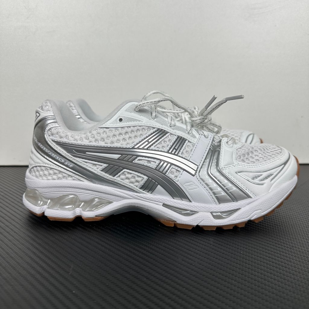 ASICS Gel-Kayano 14 A.P.C. White Pure Silver 1203A727-100 unisex sneaker with white mesh, metallic silver overlays and GEL cushioning, side view.