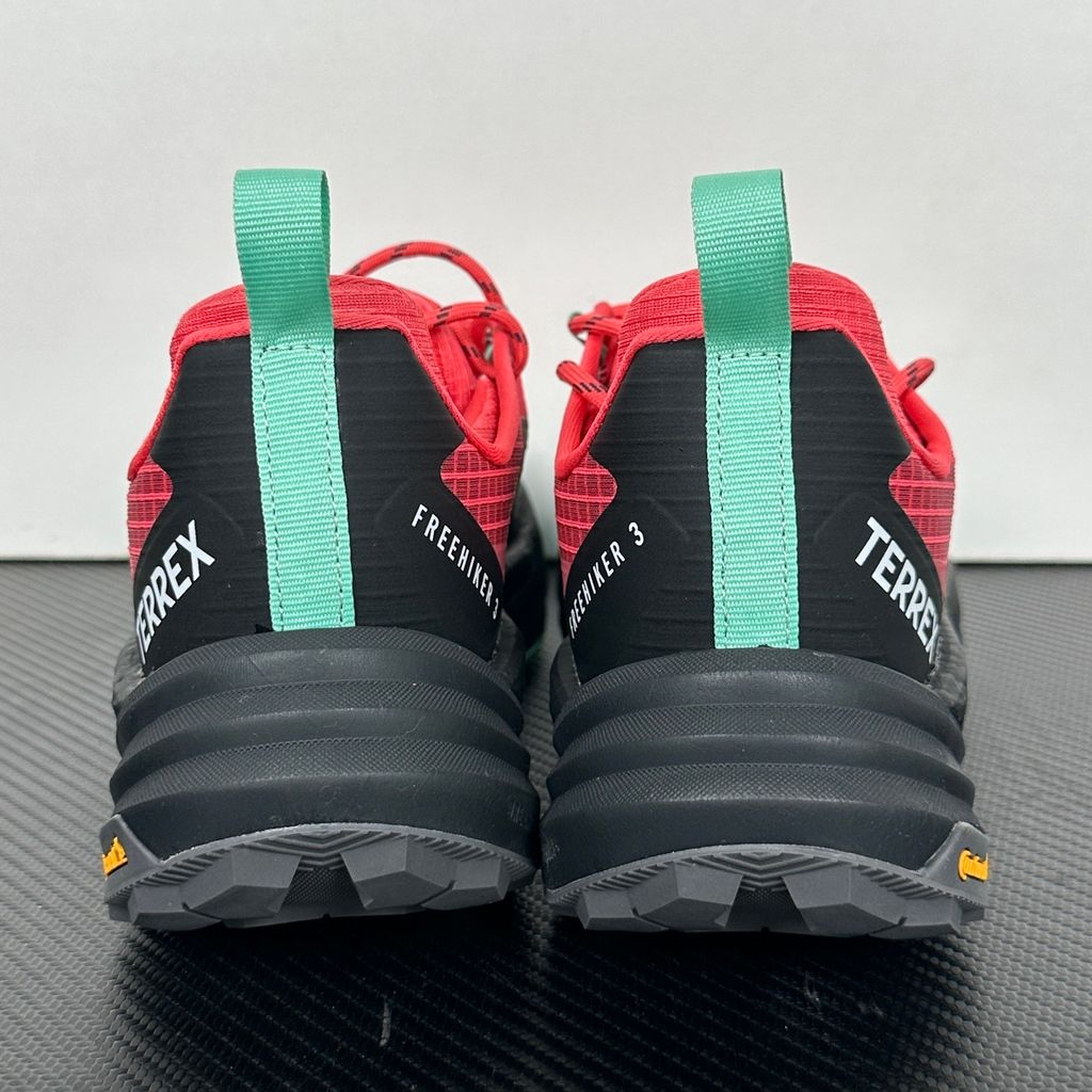 adidas TERREX Freehiker 3 Low GORE-TEX Pure Turbo KI8282 women’s hiking shoe with black accents, waterproof ripstop upper and rugged trail outsole, side view.
