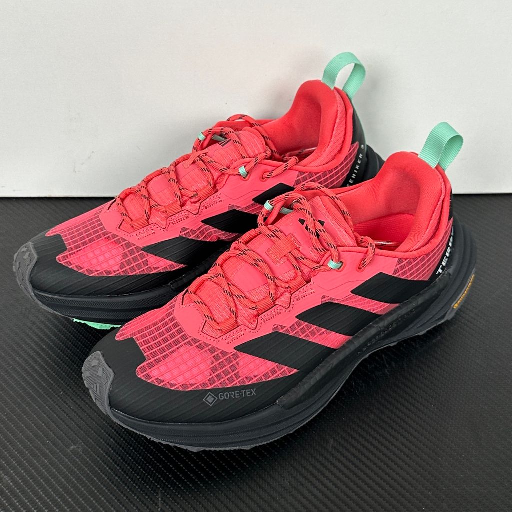 adidas TERREX Freehiker 3 Low GORE-TEX Pure Turbo KI8282 women’s hiking shoe with black accents, waterproof ripstop upper and rugged trail outsole, side view.