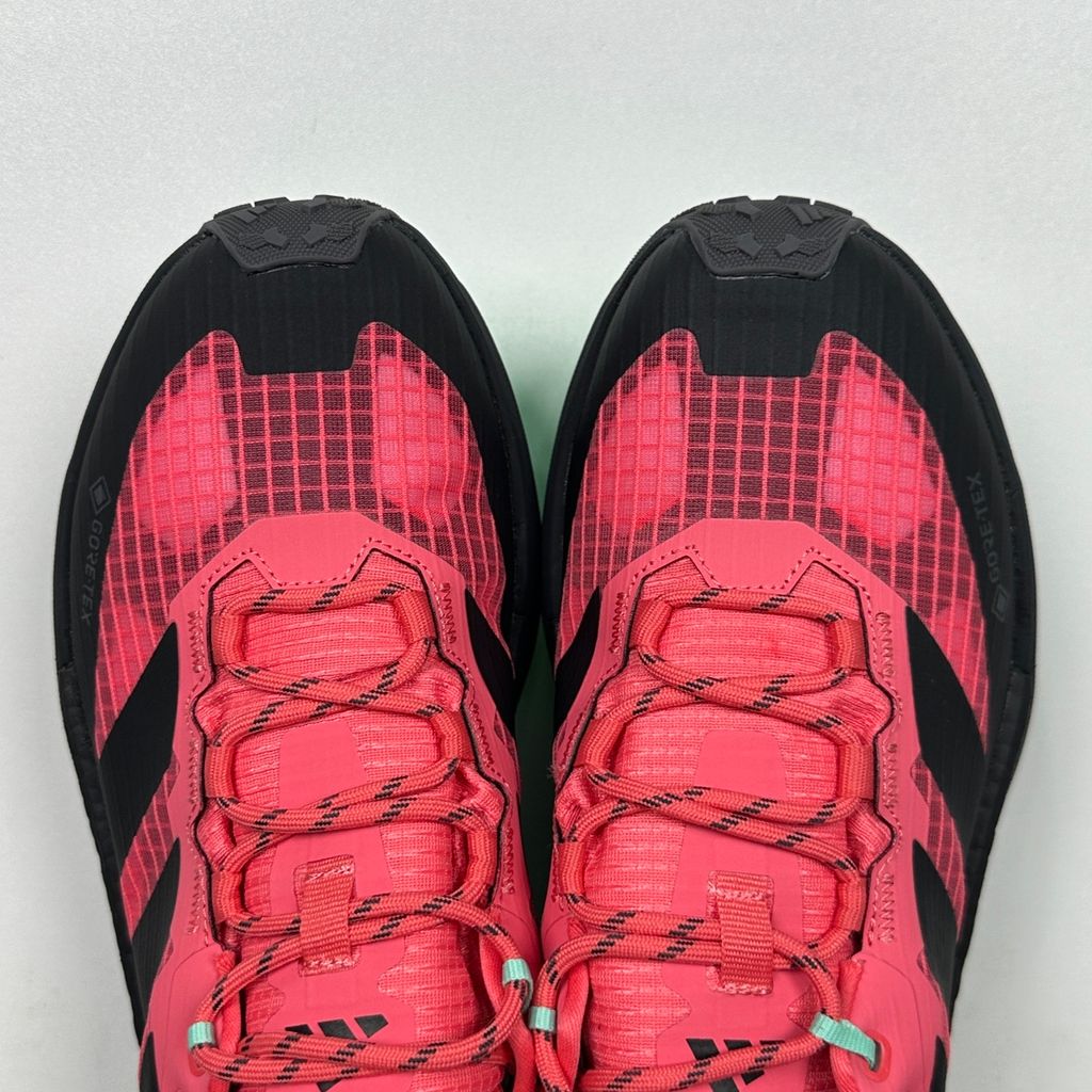 adidas TERREX Freehiker 3 Low GORE-TEX Pure Turbo KI8282 women’s hiking shoe with black accents, waterproof ripstop upper and rugged trail outsole, side view.